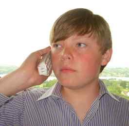 Boy speaking fluently on the phone