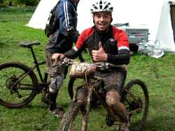 A happy rider covered in mud